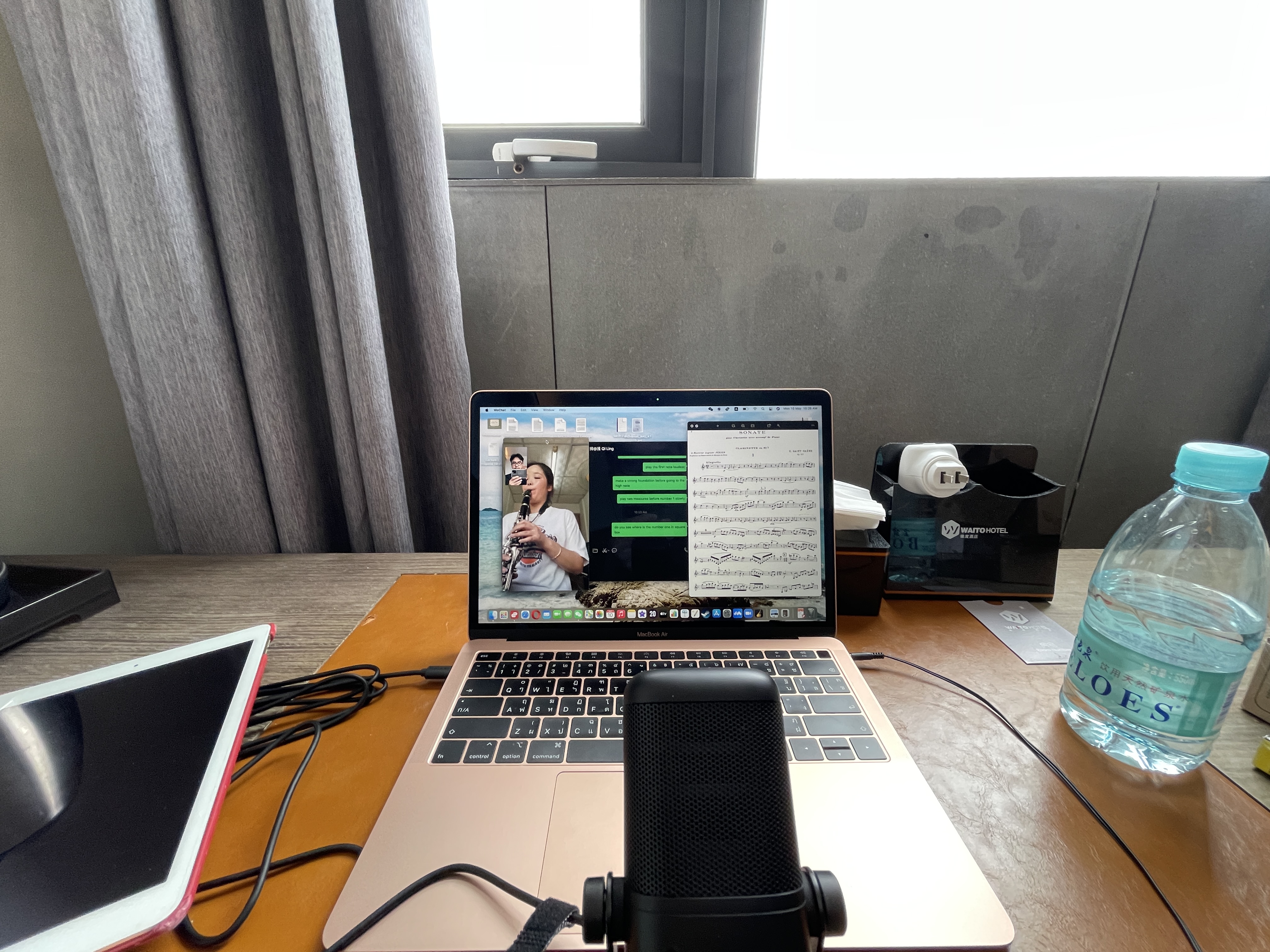 Laptop set up for a remote clarinet lesson in the hotel room